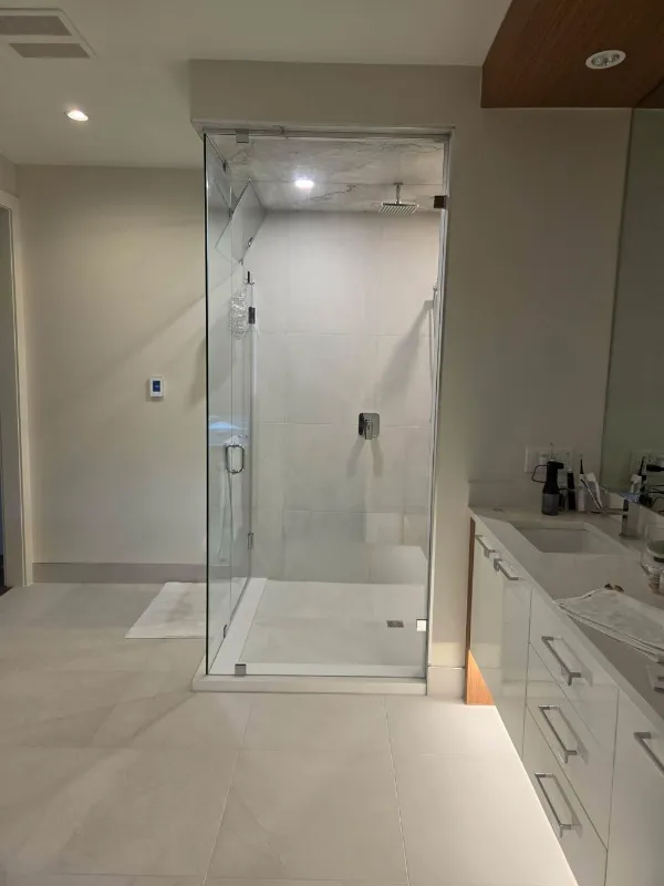 Ensuite with frameless glass shower and floating vanity